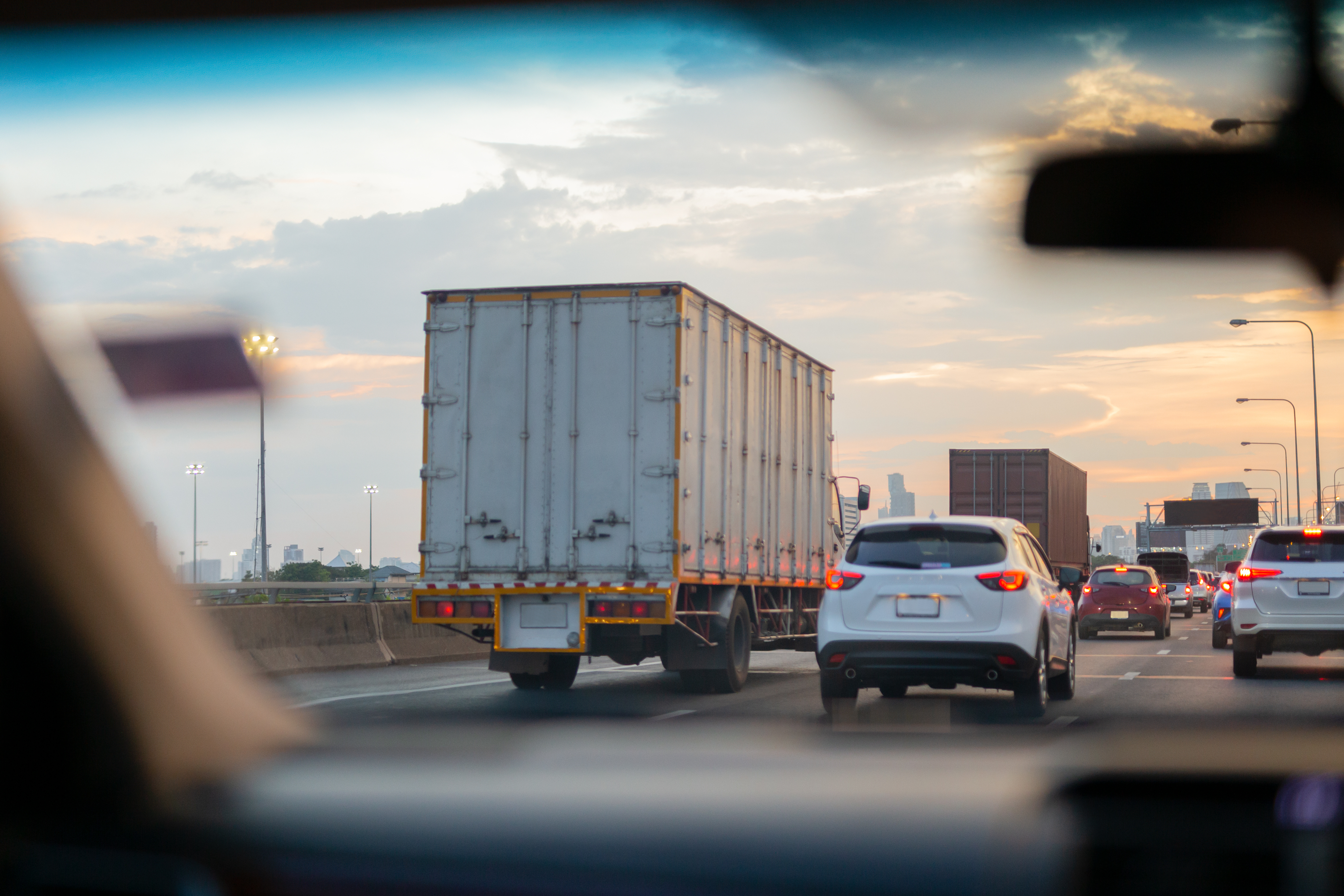 View through a windshield of congested highway traffic